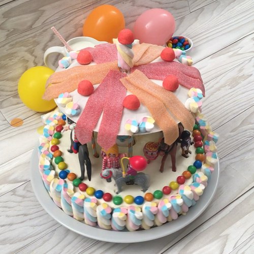 Kids cute birthday cake. Carousel horse birthday cake decorated with  carousel and number one, carnival carousel Birthday Party cake Stock Photo  - Alamy